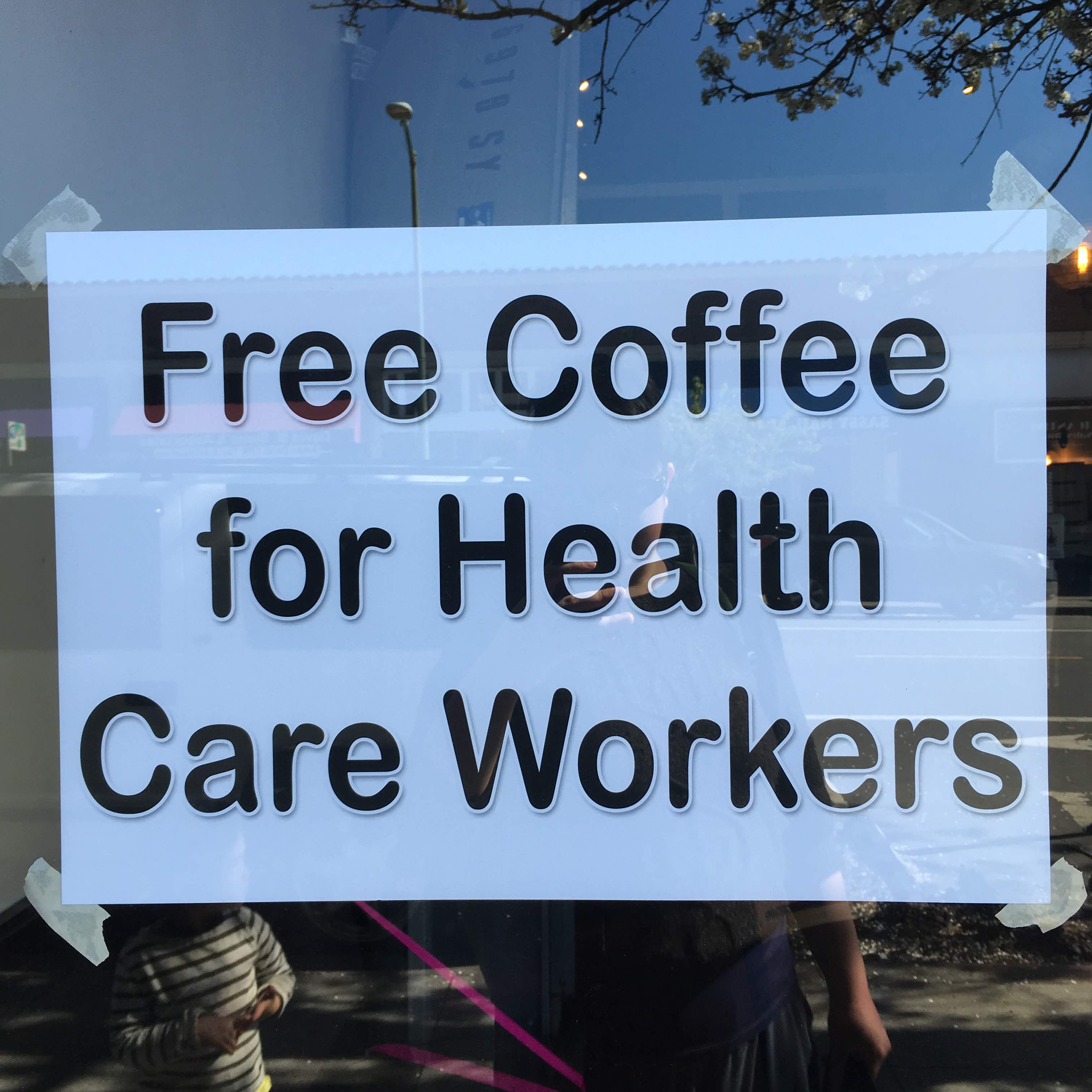 Typed sign in a cafe window: "Free Coffee for Health Care Workers"
