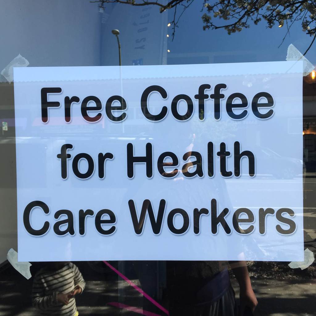 Typed sign in a cafe window: "Free Coffee for Health Care Workers"
