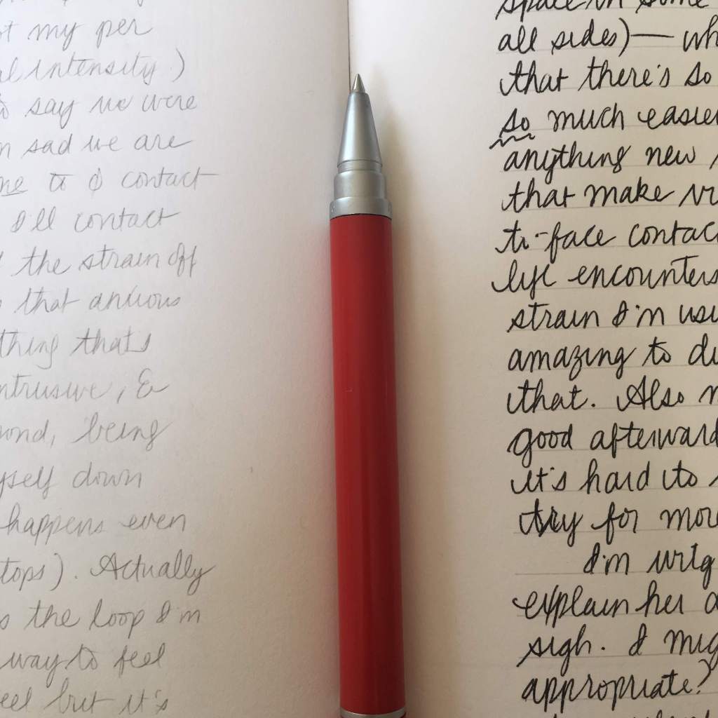 Cursive handwriting (lighter on one side, darker on the other)